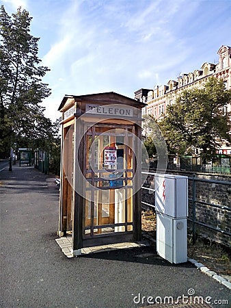 View of wooden telephone box on the street, Karlovy Vary, Czech Republic Editorial Stock Photo