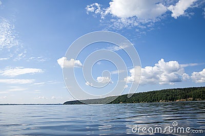 Summer clouds river reeds trees Stock Photo