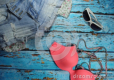 Summer collage - jeans shorts, bikini bra and sunglasses Stock Photo