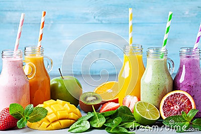 Summer colorful fruit smoothies in jars with ingredients. Healthy, detox and diet food concept Stock Photo