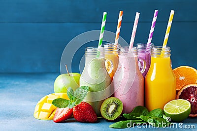 Summer colorful fruit smoothies in jars with ingredients. Healthy, detox and diet food concept Stock Photo