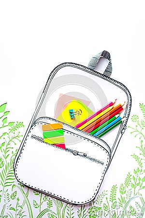 Summer concept, school backpack on green grass, made of paper Stock Photo