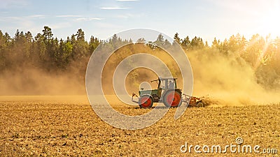 Summer countryside / agriculture harvest forest background banner panorama: old tractor milling straw grain barley wheat field, Stock Photo