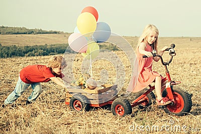 Summer at countryside. Childhood concept. Eco farm. Nature and children lifestyle. Happy kid on summer field. sweet Stock Photo