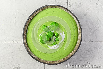 Summer cream soup with green pea, broccoli and basil. vegetarian food. top view Stock Photo