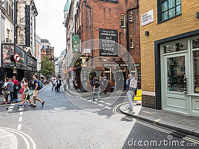Summer crowds stroll Great Windmill Street, London W1 Editorial Stock Photo