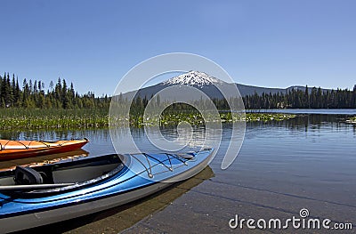 Summer Day Colorful Kayaks On Hosmer Lake Oregon Stock Photo