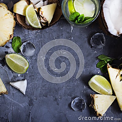 Summer drink, cocktail, tea, tropical fruits, pineapple, coconut, lime, summer background. Stock Photo