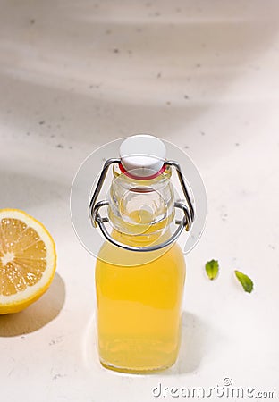 Summer drink fermented kombucha lemonade in a bottle. Copy space. Vertical photo. Stock Photo