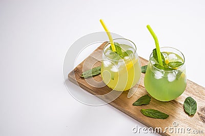 Summer drinks lemonade mojito with ice and mint on isolated background Stock Photo