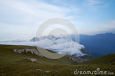 Warm summer evening in the mountains of North Osettia Green hills and magestic clouds down the hill Stock Photo