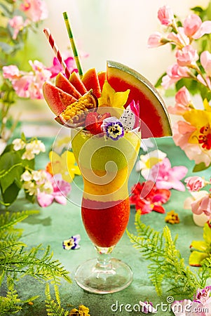 Summer exotic cocktail smoothie . Exotic fruit layered drink. Cold summer dessert Stock Photo