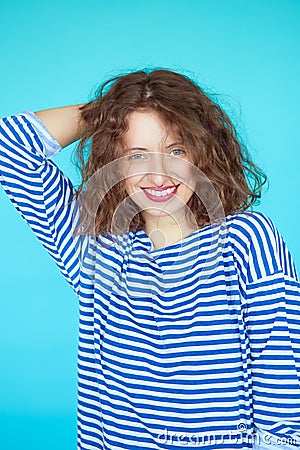 Summer fashion girl with curly hairstyle and striped shirt Stock Photo