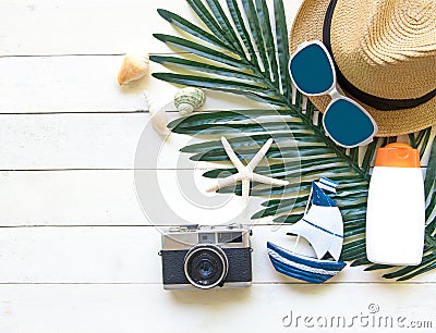 Summer Fashion woman big hat and accessories, camera and sunglasses go to travel in the beach. Tropical sea.Unusual top view, bac Stock Photo