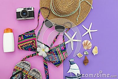 Summer Fashion woman swimsuit Bikini, camera, starfish, sunblock, sun glasses, hat. Travel in the holiday colorful background Stock Photo