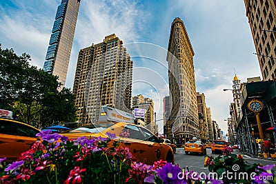 Summer 2015 Flatiron Building at Fifth Avenue and taxi cabs, New Editorial Stock Photo