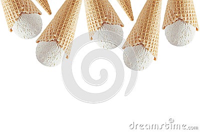 Summer food border of white creamy ice cream in crisp waffle cones isolated on white background, copy space. Stock Photo