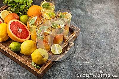 Summer fruit drink lemonade orange grapefruit lime lemon mint leaves Stock Photo