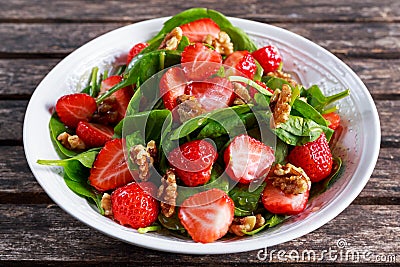 Summer Fruit Vegan Spinach Strawberry nuts Salad. concepts health food Stock Photo