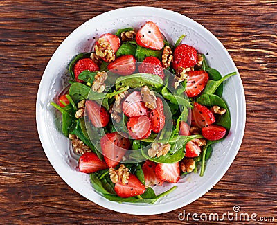 Summer Fruit Vegan Spinach Strawberry nuts Salad. concepts health food Stock Photo