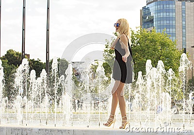 Summer girl in the glasses near Fountain Stock Photo