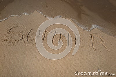 summer handwritten on sand, summer background, sea and sand background Stock Photo