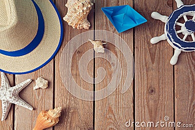 Summer holiday travel background with seashells and paper boat. View from above. Flat lay Stock Photo