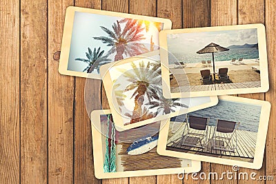 Summer holiday vacation photo album with retro polaroid instant photos on wooden table Stock Photo