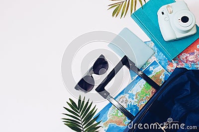 Summer holidays concept. Travel, tourism and vacation concept background. Traveler accessories. Flat lay. Blue suitcase with trav Stock Photo