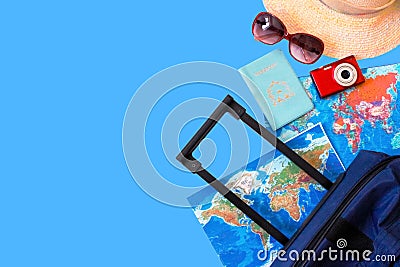 Summer holidays concept. Travel, tourism and vacation concept background. Traveler accessories. Flat lay. Blue suitcase with trav Stock Photo