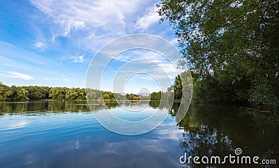 Summer lake landscape with green trees and bush, Woking, Surrey Stock Photo