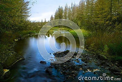 Summer landscape with river cloudy sky forest and sun Stock Photo