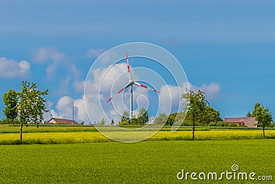 Summer landscape with wind turbines. Sunny rural fields. Renewable energy, environment background concept Stock Photo