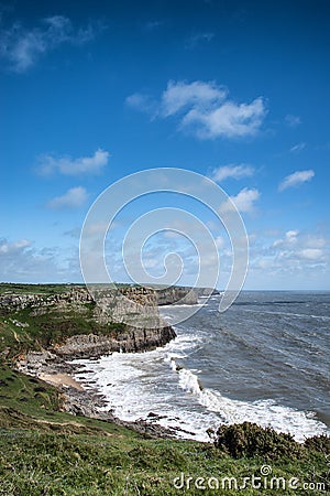 Summer landscape of Worm's Head and Rhosilli Bay in Wales Stock Photo