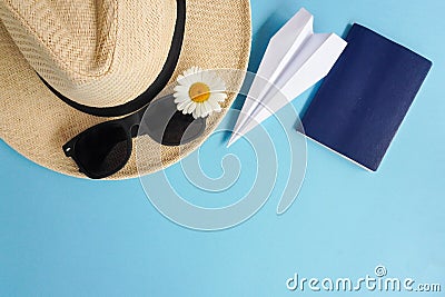 Summer layout with straw hat, daisies and sunglasses, Passport and airplane. Top view of Concept of travel and recreation. Flights Stock Photo