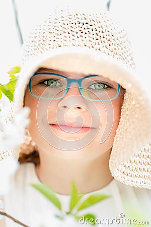 Summer little girl in straw hat outdoor portrait. Stock Photo