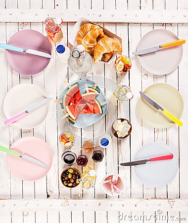 Summer lunch served on a picnic table outdoors Stock Photo