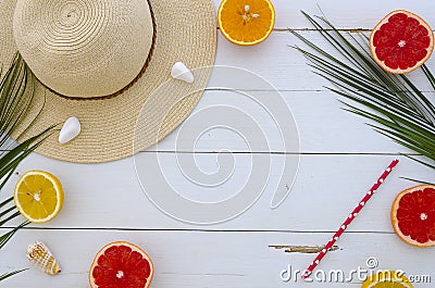 Summer mood juicy lobes of lemon, orange and grapefruit, fresh citrus and sun hat. Time to drink cocktails. Hand Stock Photo