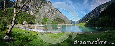 Summer morning at the Stillup reservoir in the Zillertal in Tyrol Stock Photo