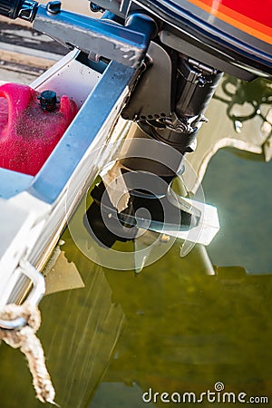 Motor off the back of a small boat. Stock Photo