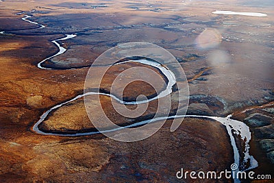 Summer nature landscape from above. Mountain range aerial view. river bank in the morning in the tundra. Taimyr Peninsula, Russia Stock Photo