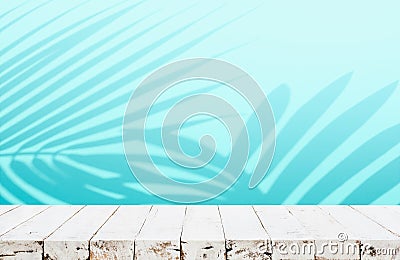 Summer and nature product display with wood table counter on blur coconut leaf background in blue color Stock Photo