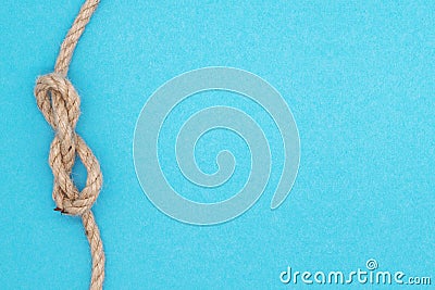Summer nautical composition, bright background with rope nodal knot Stock Photo
