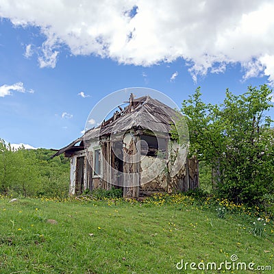 Retro structure -the house of a farmer of the last century on a ranch in nature. Stock Photo