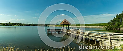 Summer in Omaha, Panorama Pier or gazebo with Reflection on the lake Ed Zorinsky lake park, Omaha, Nebraska, USA Stock Photo