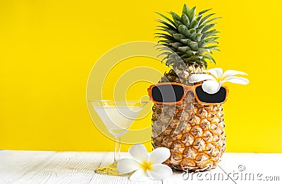 Summer in the party. Hipster Pineapple Fashion in sunglass and fruit juice bright beautiful color in holiday, Stock Photo