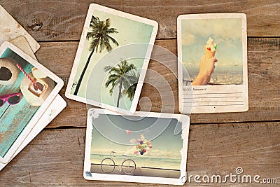 Summer photo album on wood table. Stock Photo