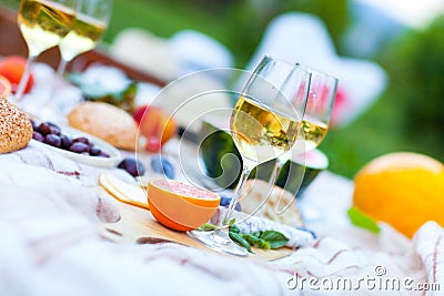 Summer Picnic Basket on the Green Grass. Food and drink concept. Stock Photo