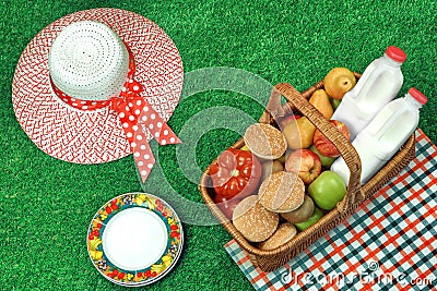 Summer Picnic Concept With Straw Hat And Food Basket Stock Photo