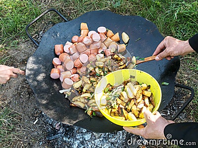 Summer picnic. Preparation of delicious sausages Stock Photo